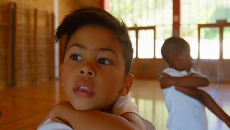 schoolkids performing yoga in elementary school 4k