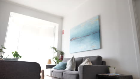 panning shot of office lobby with plants and windows