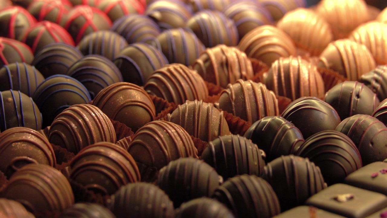 A sweeping shot across a forest of freshly hand made chocolates