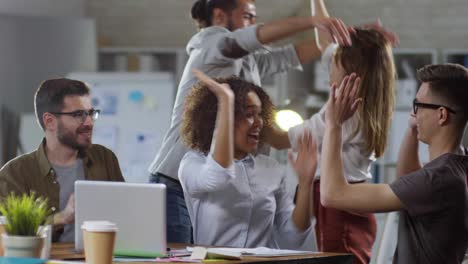 ecstatic business team celebrating success