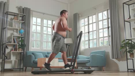man running on treadmill at home