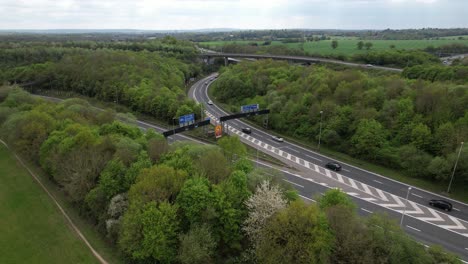 m1 m25 motorway uk junction cars splitting in two directions drone aerial view