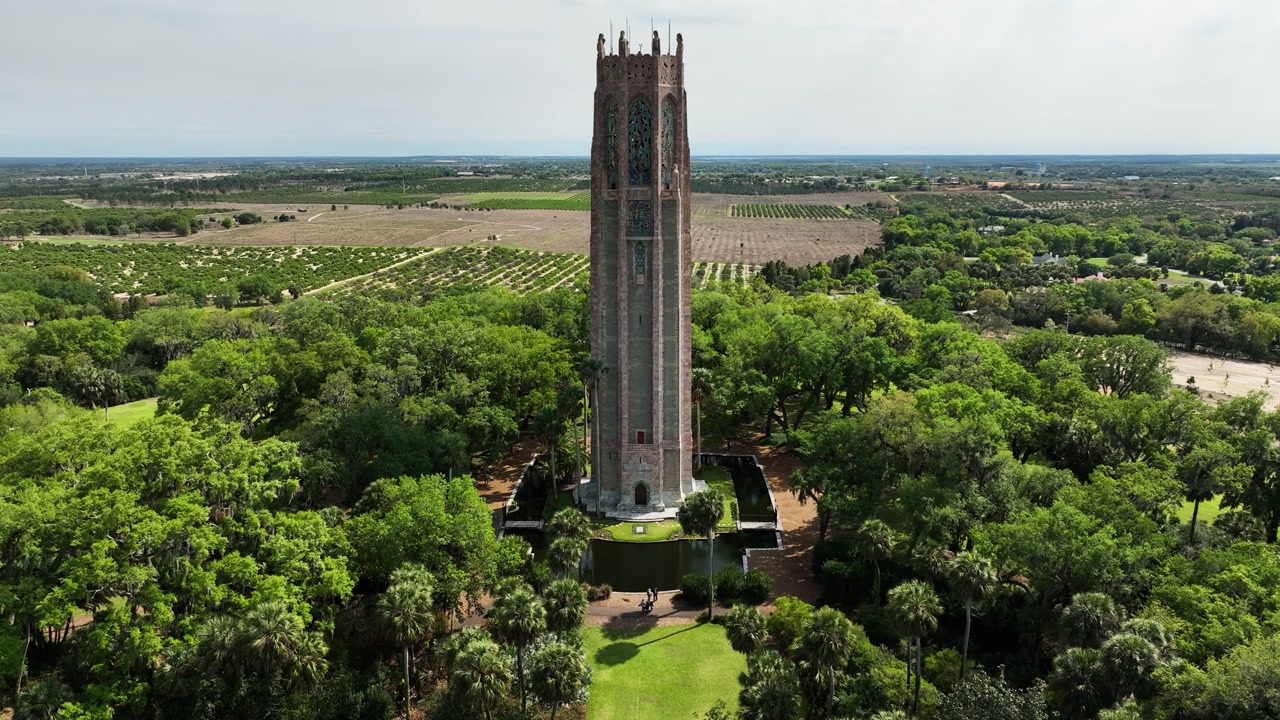 An aerial view of Bok Tower rises above lush gardens and natural Florida landscape in Lake Wales.