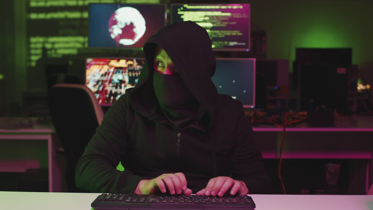 Unrecognizable Hacker Making Code