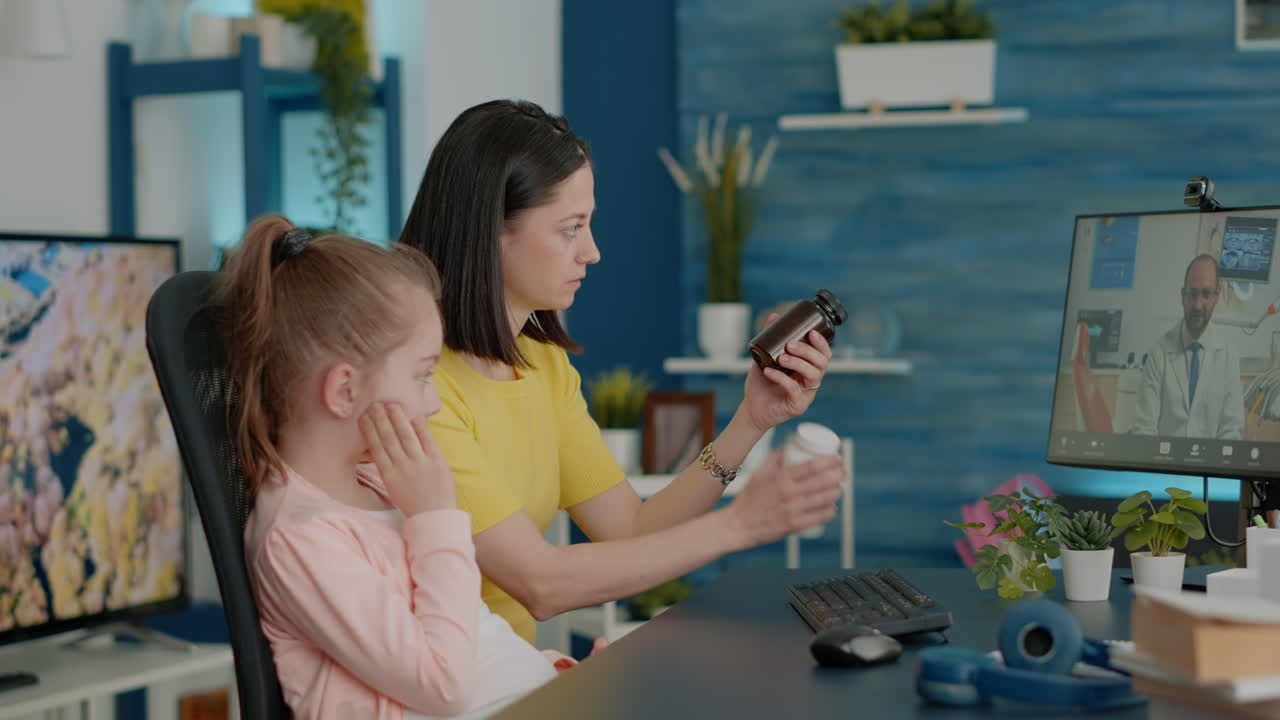 Mother of girl with toothache talking to dentist on video call