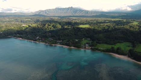 cinematic arial view over anini beach, kauai, hawaii