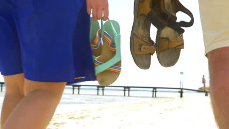 Summer-Shoes-in-People-Hands