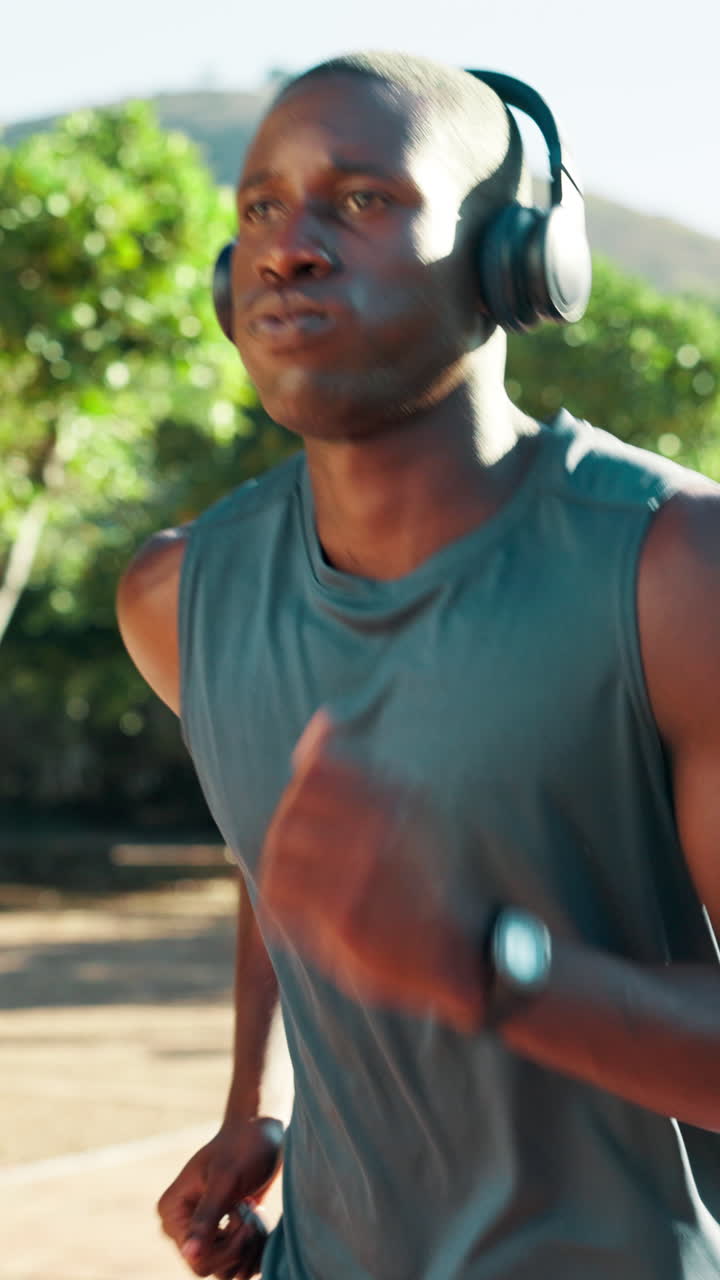 Close-up of Man Running Outdoors with Headphones
