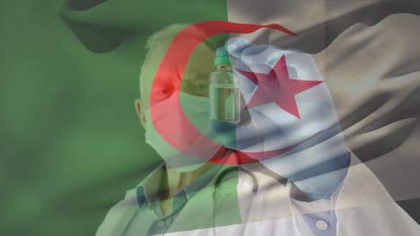 Animation-Der-Flagge-Algeriens,-Die-über-Einem-Arzt-Weht,-Der-Eine-Gesichtsmaske-Trägt-Und-Einen-Impfstoff-In-Der-Hand-Hält