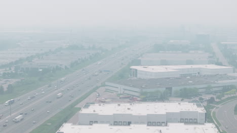 smoky, hazy atmosphere over highway in mississauga due to wildfire smoke
