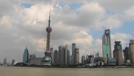 boats on the yangtze river passing the pudong district in shanghai