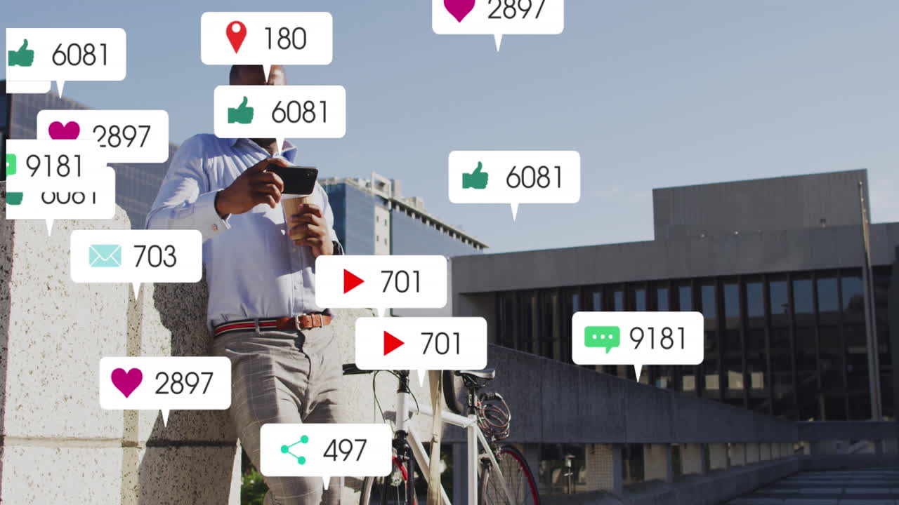 animación de iconos de las redes sociales sobre un hombre afroamericano usando un teléfono inteligente en el parque corporativo