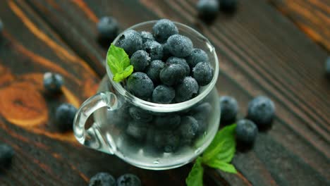 jug full of blueberry with green leaf