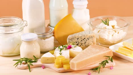 variety of dairy items on orange background