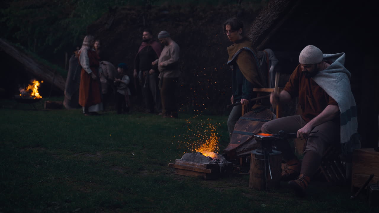 Medieval Campfire Scene with Blacksmith and Gathering