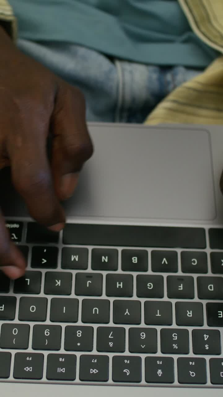 Person Typing on a Laptop