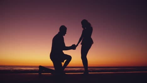 young couple by the sea