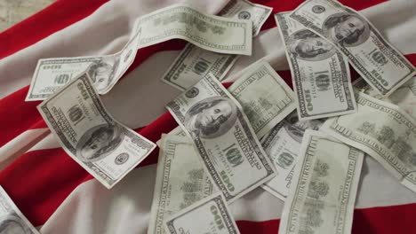 Close-up-of-american-flag-with-banknotes-and-red-and-white-stripes