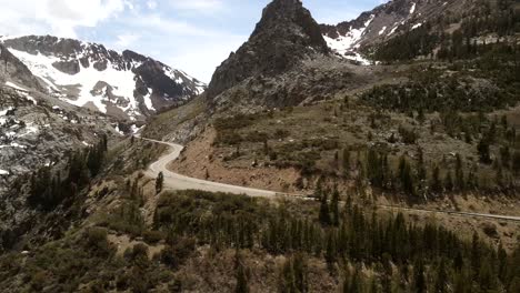 Captivating-cinematic-footage-of-Yosemite-National-Park-captured-from-a-drone,-showcasing-snow-capped-peaks