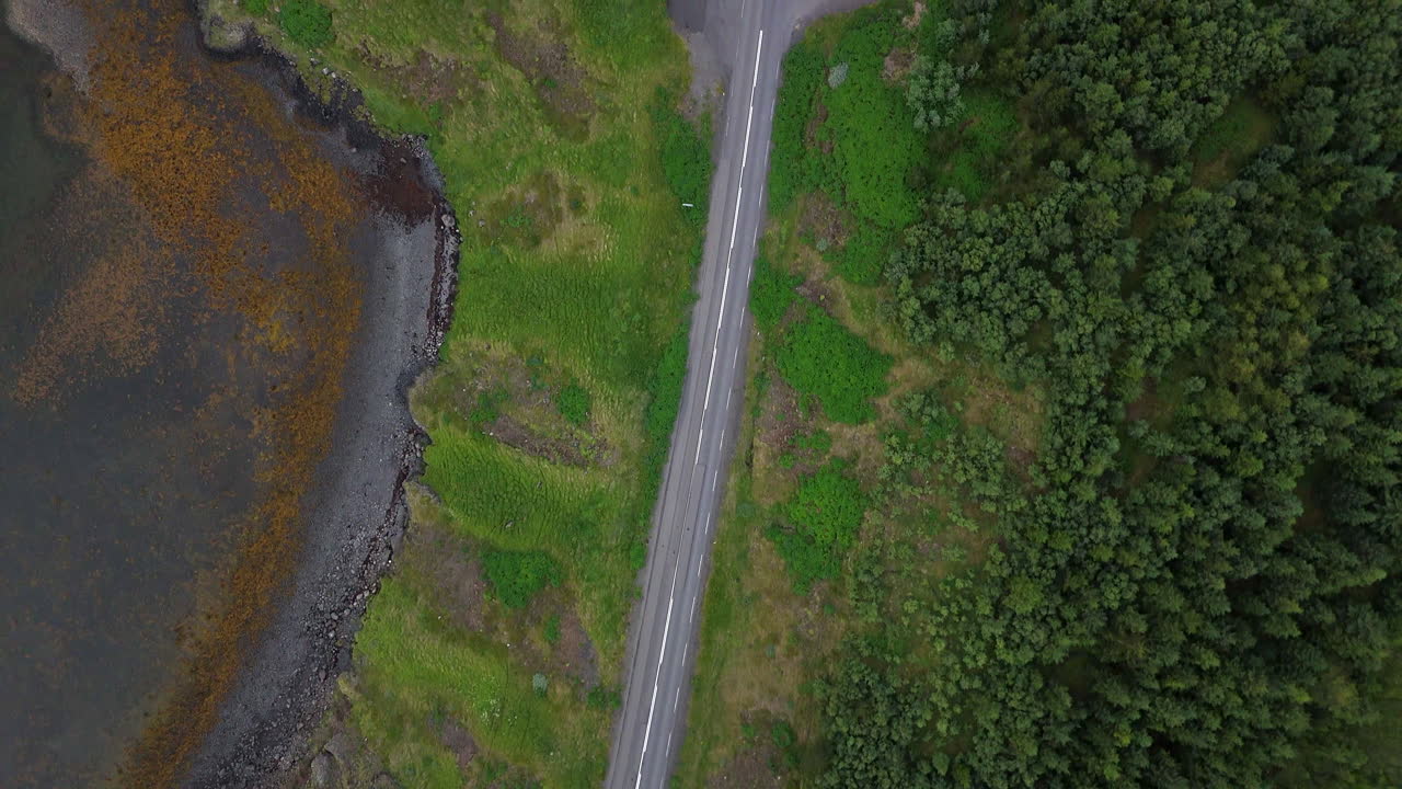Aerial view of Hvalfjörður fjord in Vesturland Iceland, showing calm waters, surrounding mountains, and expansive Icelandic landscape from above