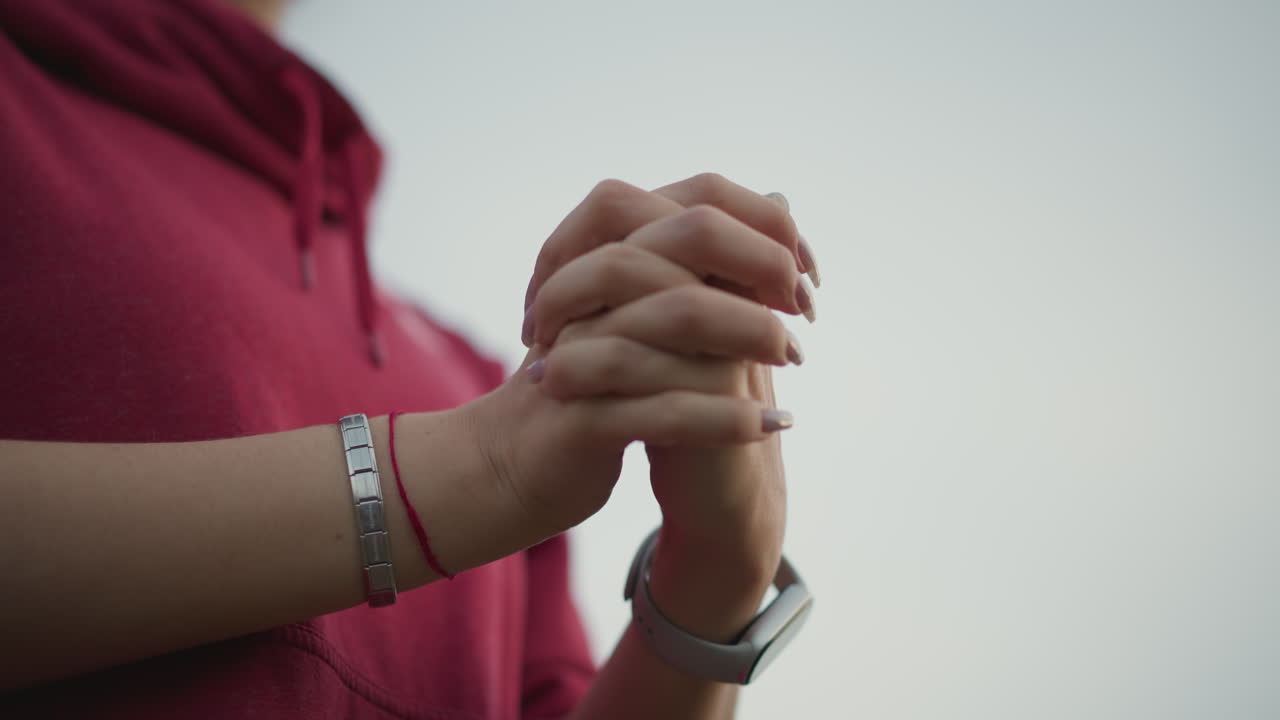 Dancer Hands Warming Before Rehearsal Closeup. Deliberate Wrist Rotations And Fingertip Stretches, Manicured Nails, Layered Bracelets And Smartwatch, Soft Overcast Sky, Expressive Movement Preparing