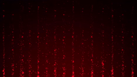partículas rojas que se mueven hacia arriba contra un fondo oscuro