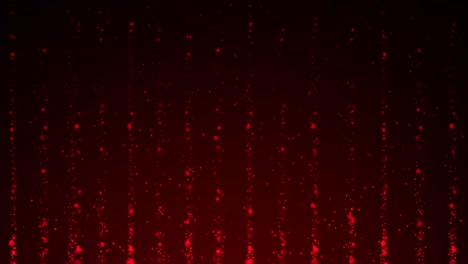 red particles moving upward against a dark background