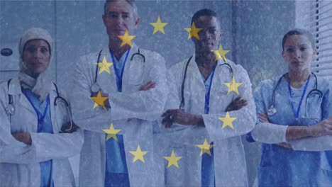 Yellow-stars-spinning-against-group-of-doctors-crossing-their-arms