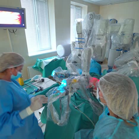 surgical room with robotic technology. doctors using robotic system for minimal invasive surgery