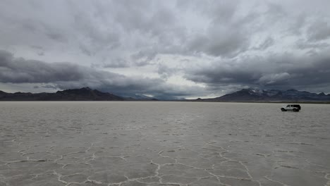 off roading with a jeep wrangler in the bonneville salt flats, utah. (4k uhd)