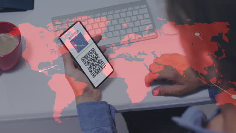 animation of man holding smartphone with covid 19 vaccination passport over world map