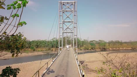 Bridge-in-metal-structure,-aerial-view-with-drone,-sunny-day