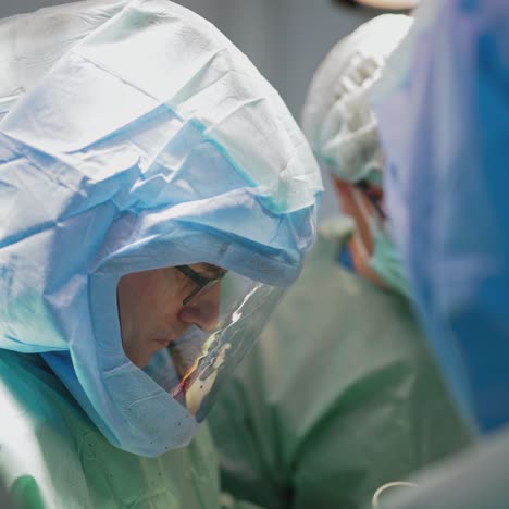 in surgery. medical team performing operation in hospital operating theater. working with surgical instruments