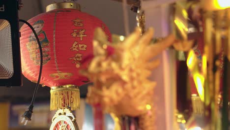 golden dragon figure against paper chinese lantern