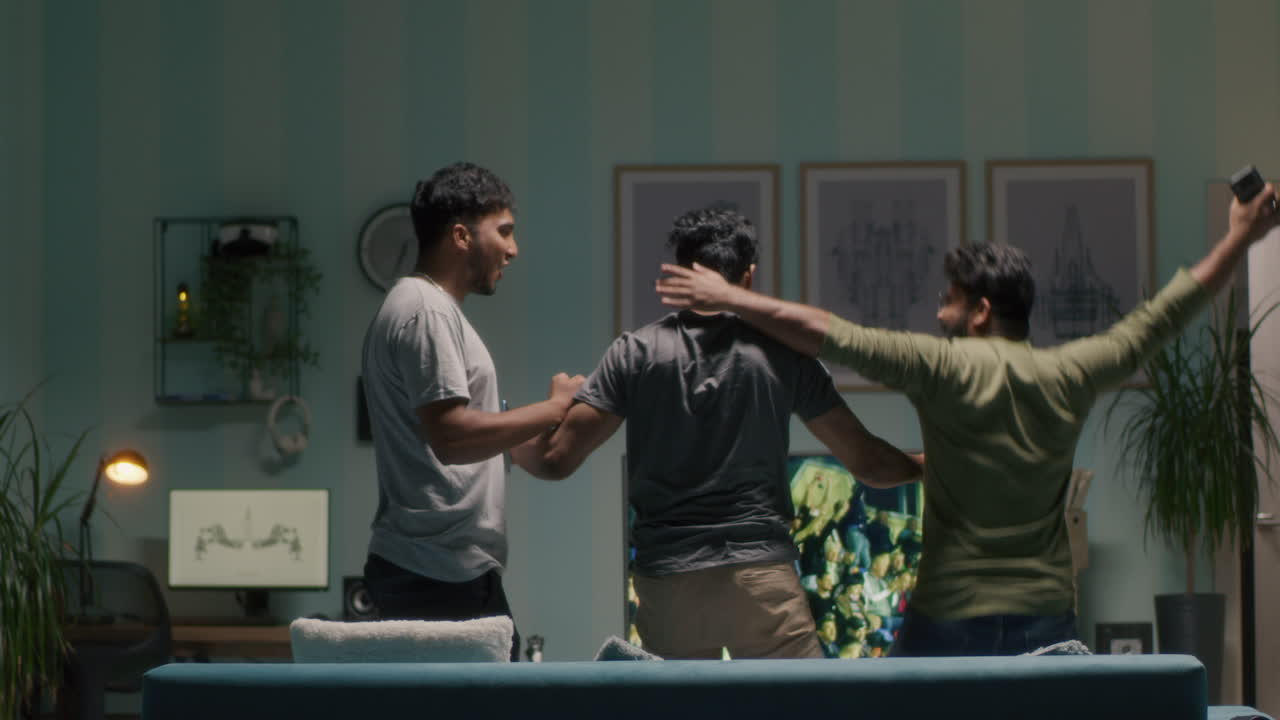 Friends Watching and Reacting to a Football Match on TV