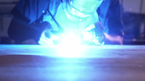 welder using welding torch