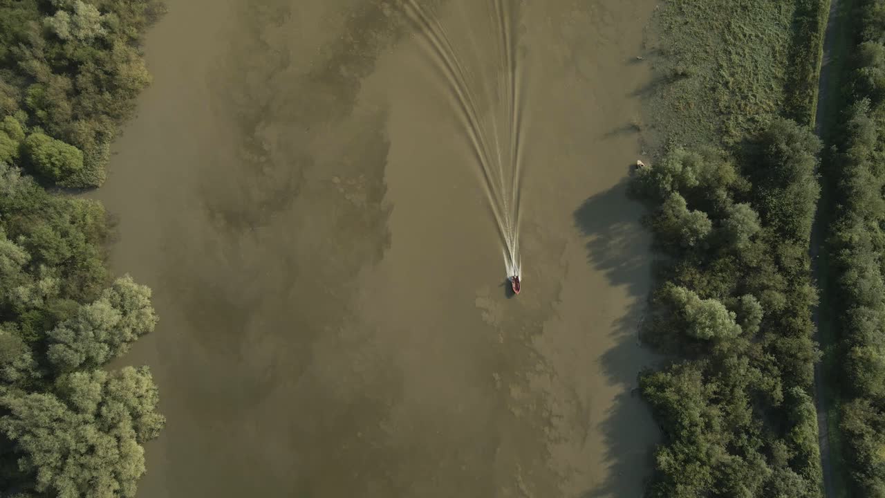 Above View Of A Boat On Shannon River Near Limerick City In Ireland. Aerial Shot