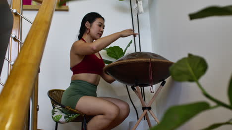woman playing handpan