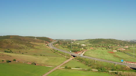 aerial: a highway going through the country side of the algarve in portugal