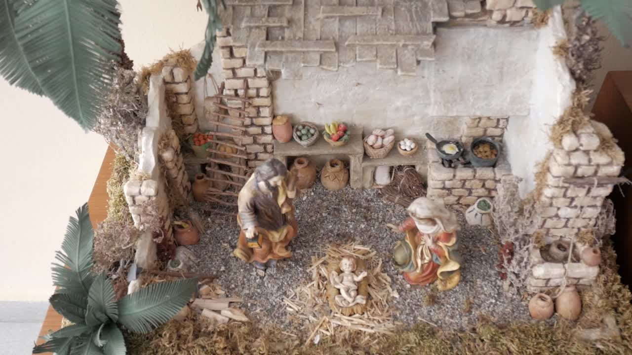 Handcrafted nativity scene with figurines, capturing a traditional Christmas display