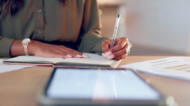 Notebook, planning and woman hands writing