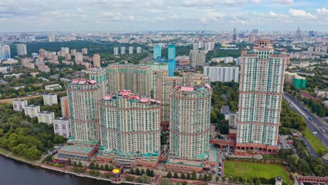 aerial view of a group of modern stylized skyscrapers in the urban area next to the river, moscow, russia