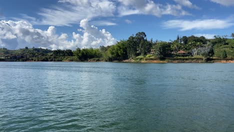 sailing in guatape great lake with a boat