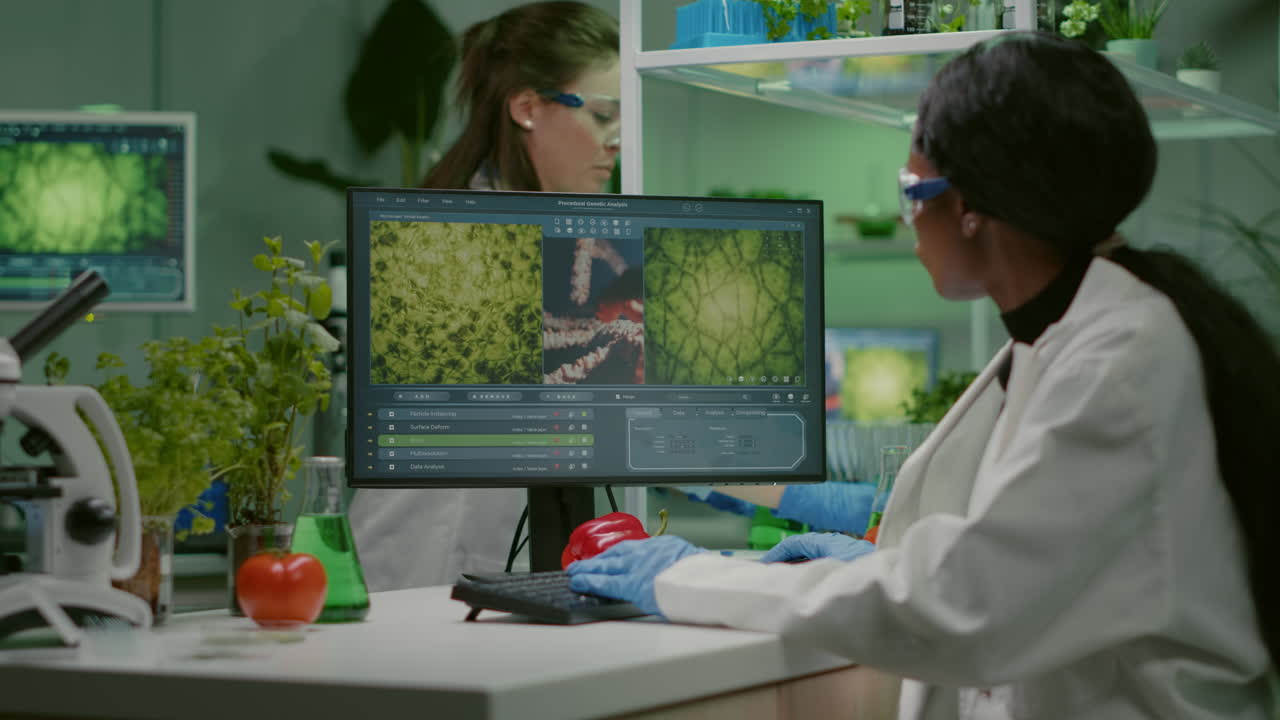 Scientist woman typing microbiology expertise on computer