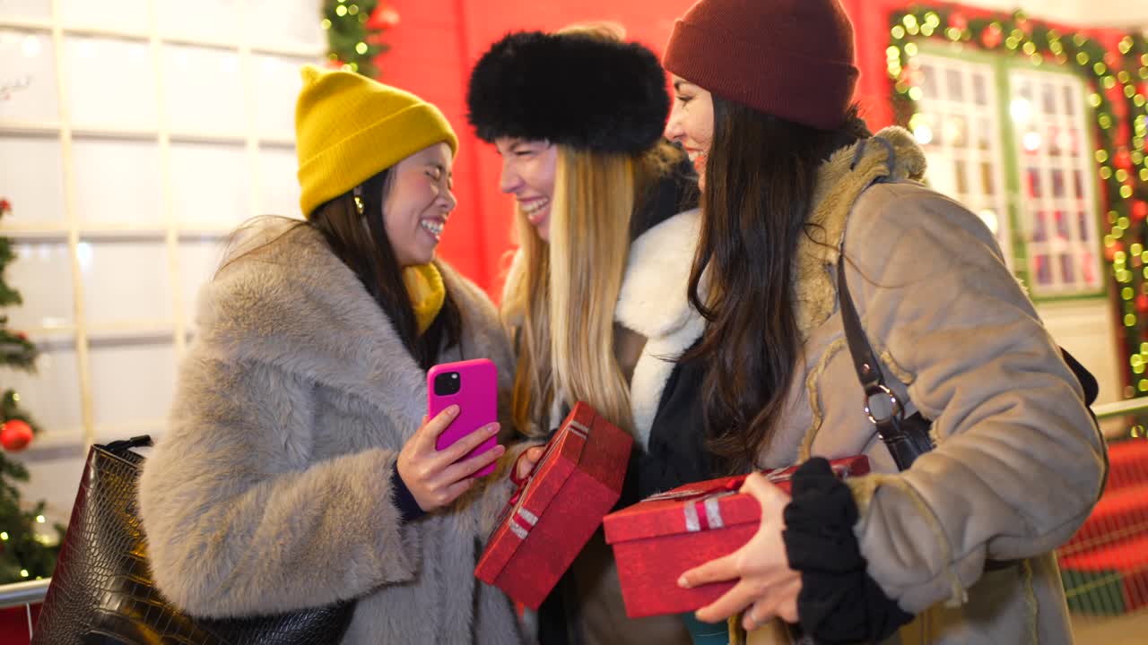 Women exchanging Christmas gifts
