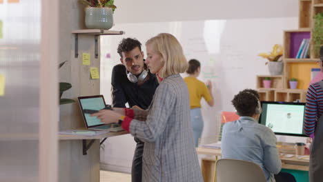 young-business-people-brainstorming-hispanic-team-leader-businessman-showing-support-helping-colleague-sharing-ideas-enjoying-teamwork-using-laptop-computer-in-modern-office