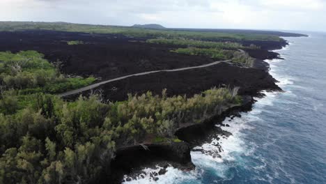 Flying-in-and-around-the-2018-flow-that-reached-the-ocean-with-forest-reserves-surrounding-it-and-the-new-road-on-top-of-it