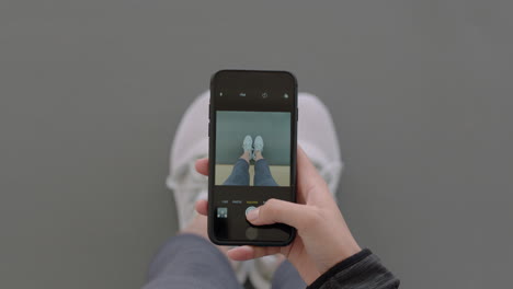 above-view-woman-hands-using-smartphone-taking-photo-of-new-shoes-sharing-photography-on-social-media-enjoying-stylish-fashion