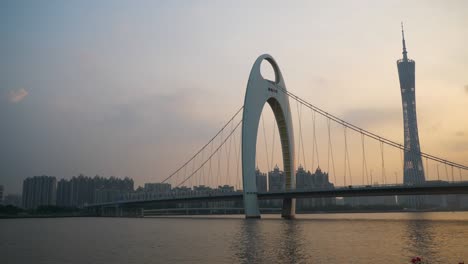 sunset time guangzhou city famous bridge canton tower riverside slow motion panorama 4k