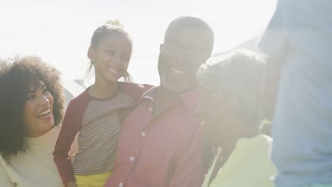 video of happy african american family spending time together in the garden